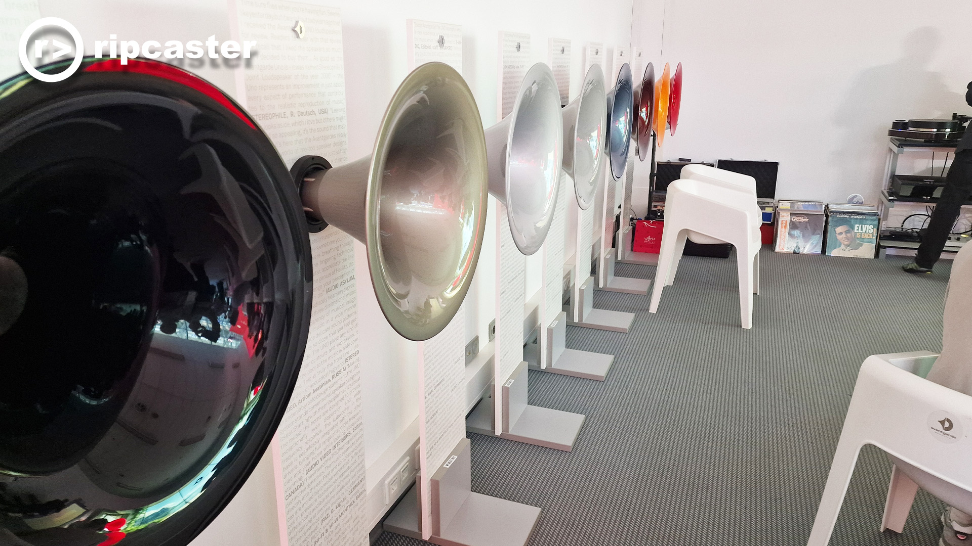 A row of different coloured speaker horns
