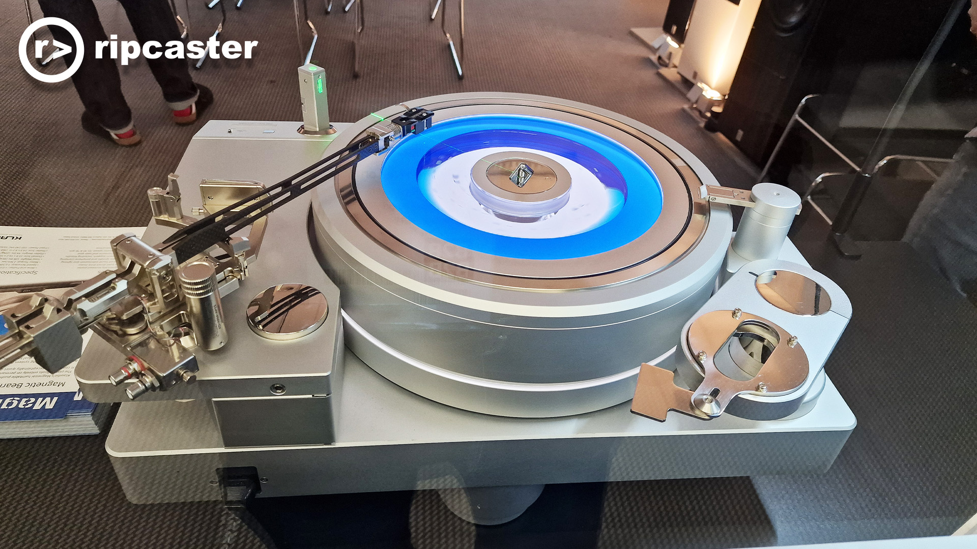 A record player with a blue disc of light.