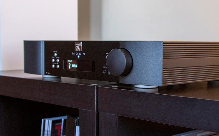 MOON 240i on dark wooden shelves