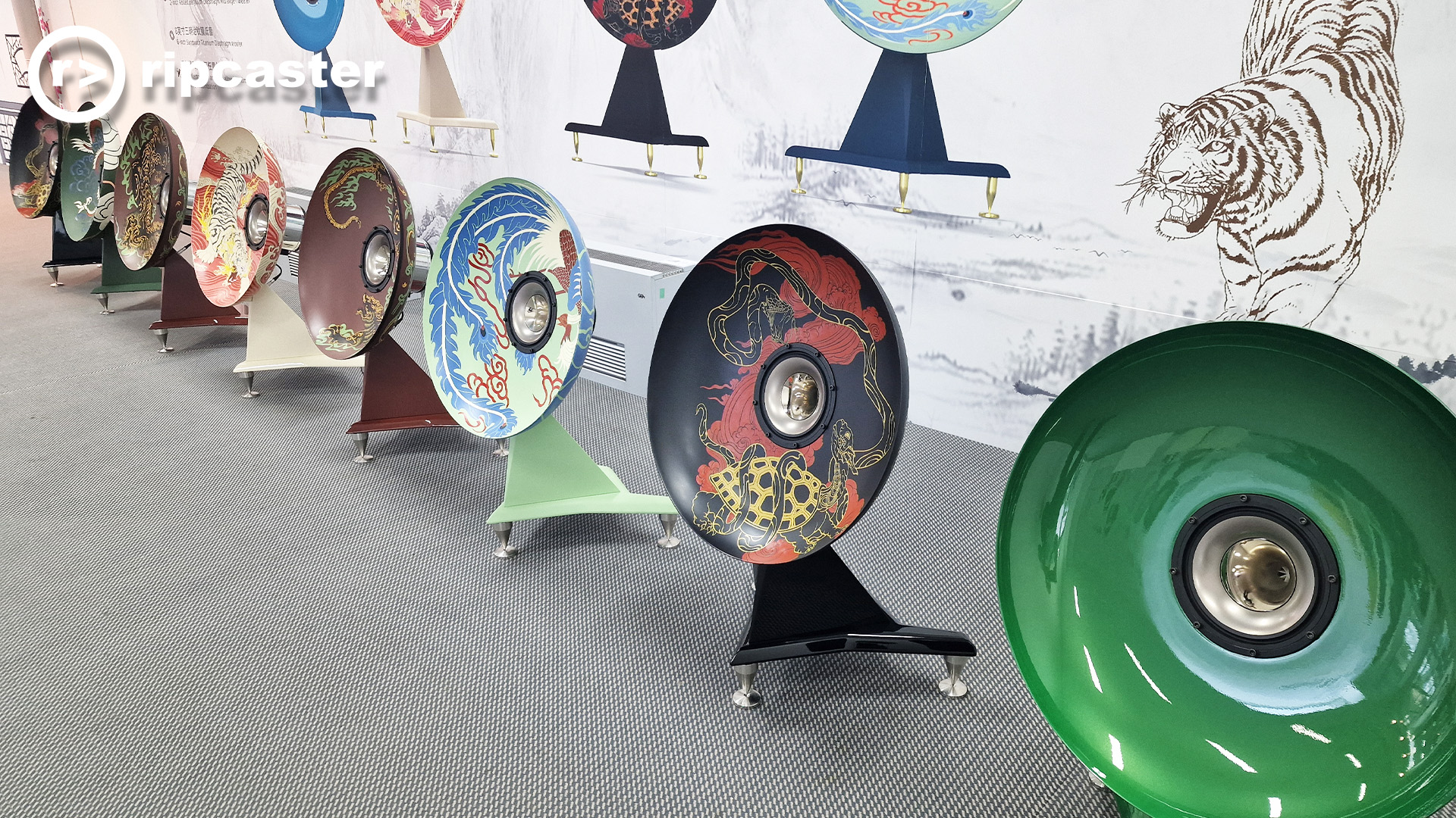 These are stunning artistic speakers with a different painting on the dish of each speaker and a backdrop showing the artwork and a tiger.