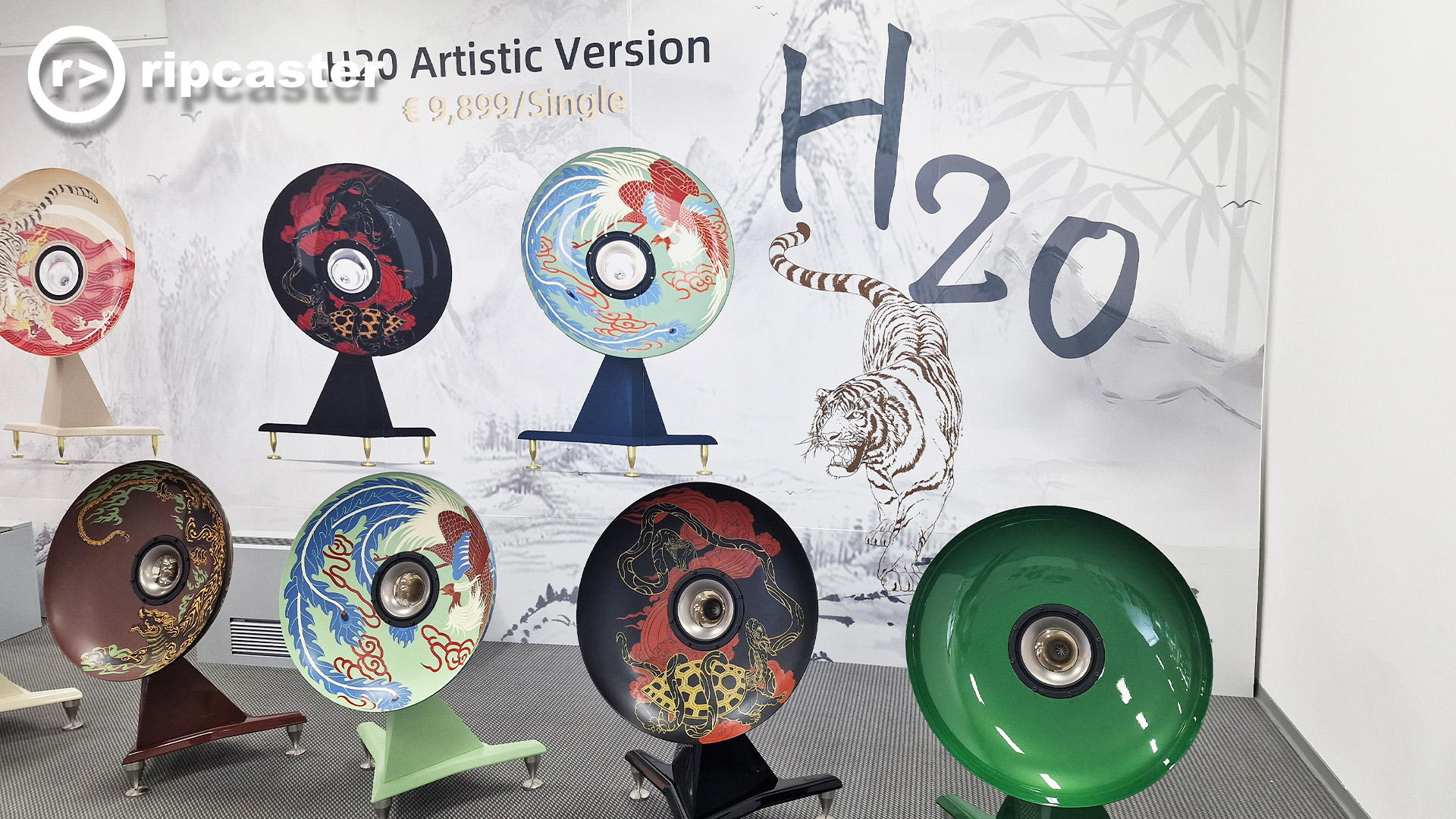 The same artistic speakers with the backdrop and the painted "H2O" on the backdrop above the tiger