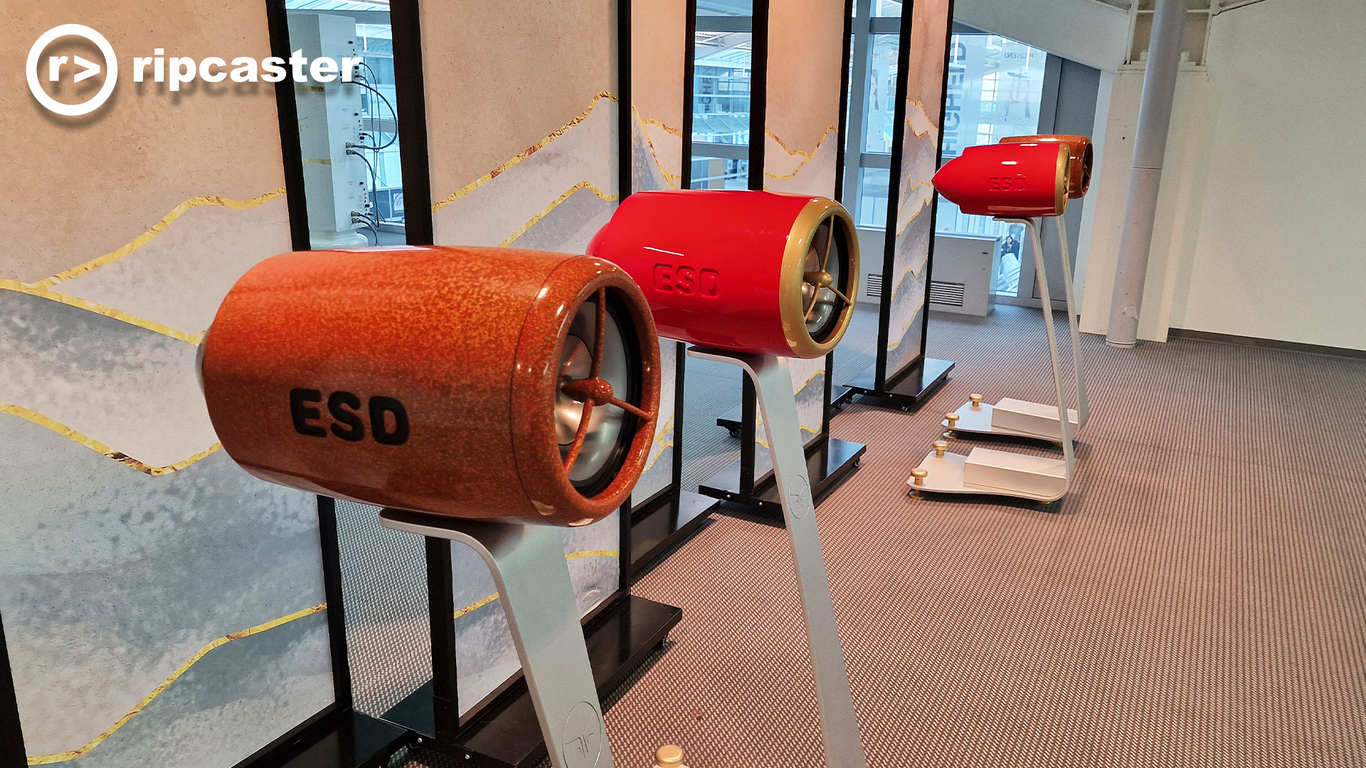 Some red and orange speakers on stands that look like aircraft engines.  they have "ESD" stamped on the side in large capital letters