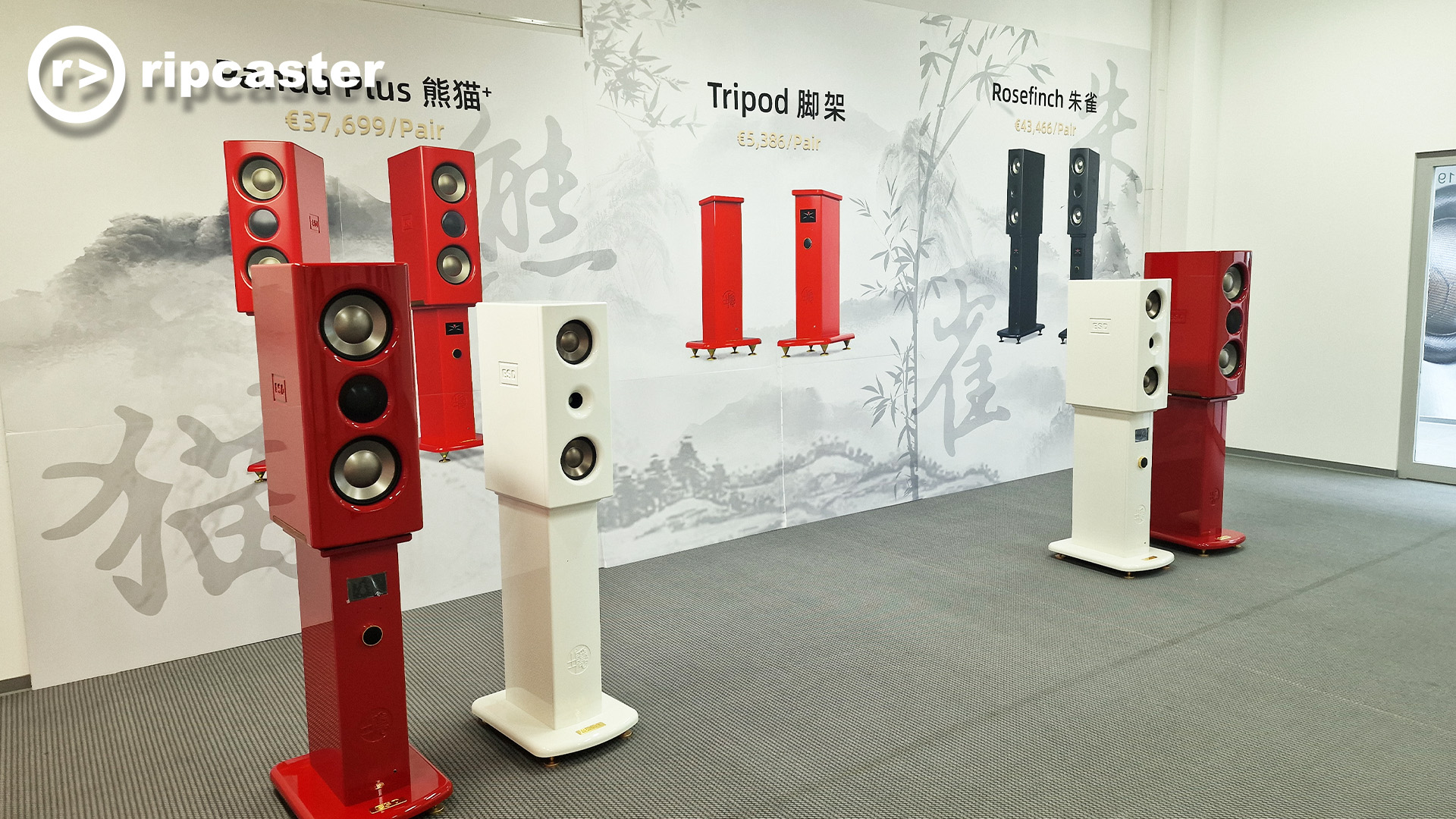 Speakers on stands.  Two red and two white.