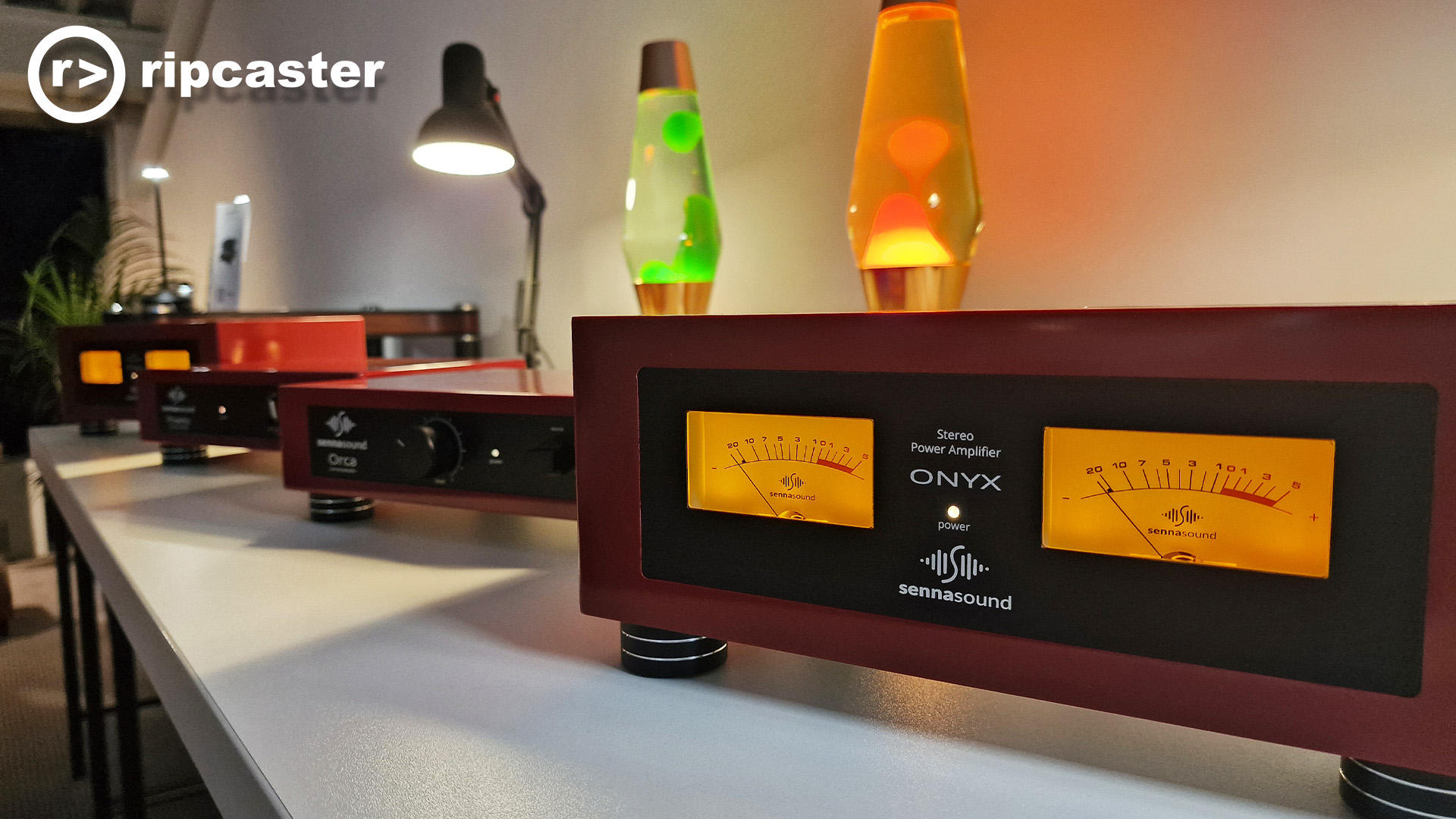 Lava lamps behind some HiFi kit.  the one in the foreground has a very nice VU meter.