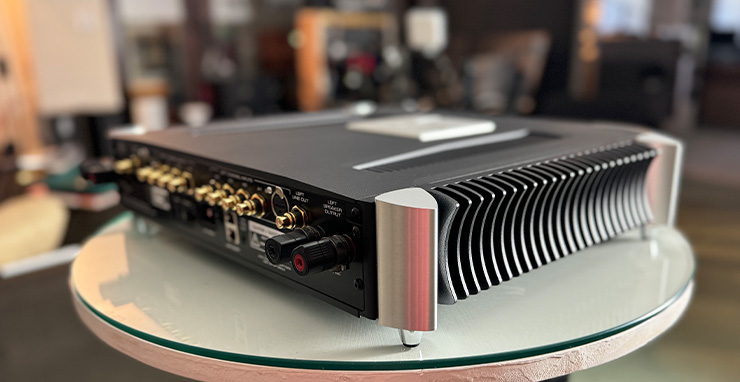 MOON 641 on a white circular table. Viewed from the rear corner showing the back of the unit and the side with it's curved stick out bits..