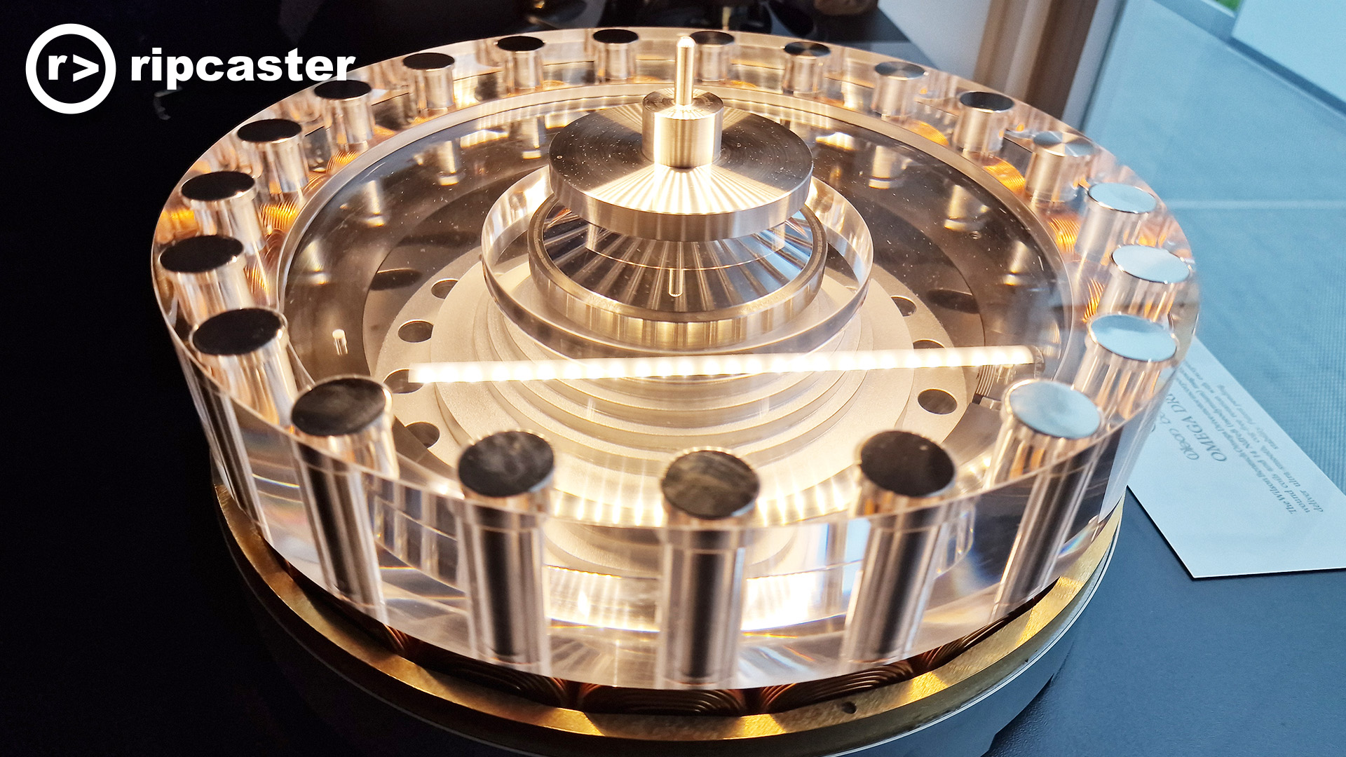 I don't know what this is but it looks amazing.  Like a thick acrylic disc with silver cylinders all around the outside of it and a round disc in the centre