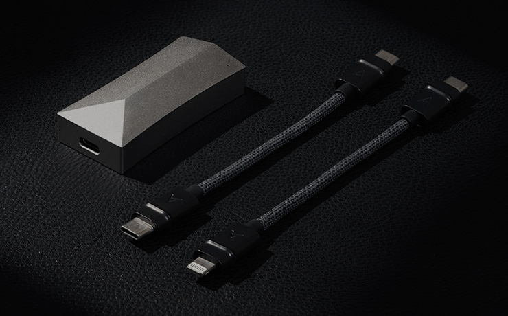 Astell & Kern AK HC4 DAC and Amp laying on a black surface