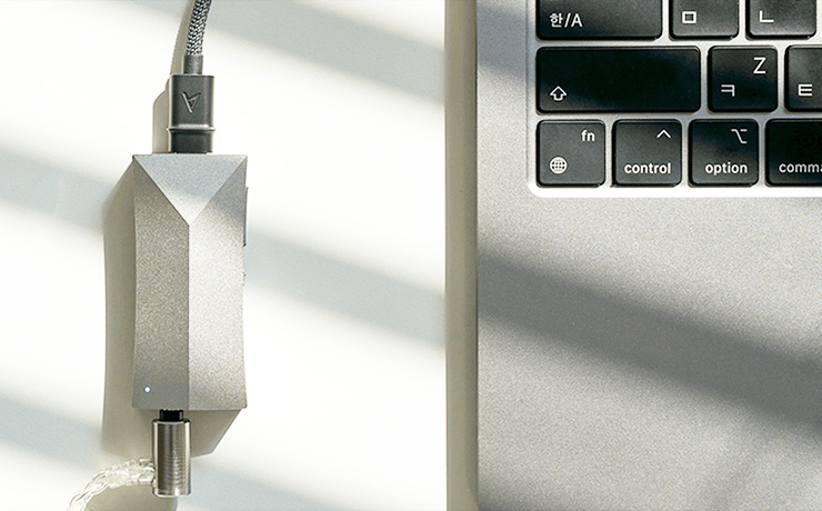 The Astell & Kern AK HC4 DAC and Amp connected to a laptop