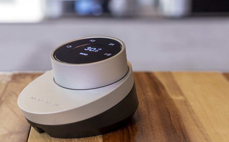 The MOON BRM-1 remote on a wooden table
