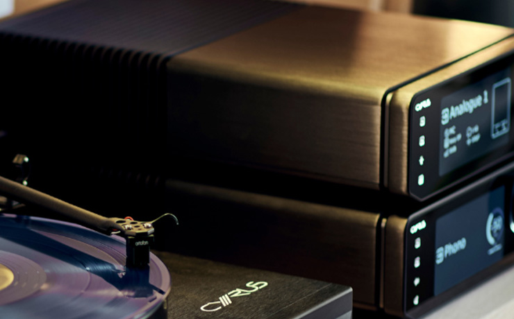 The Cyrus 40 PPA Phono Stage with another piece of Cyrus kit on top of it.  Both are beside the Cyrus turntable