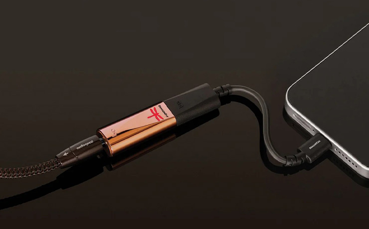 The DragonFly Copper plugged into a phone using the DragonTail