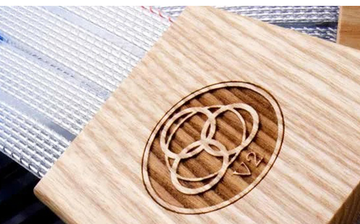 A close-up of the Valhalla 2 logo on a wooden part of the cable