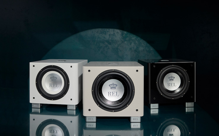 The Three REL T/9x finishes. Left to right: white, grey and black on a black background with a mirrored floor