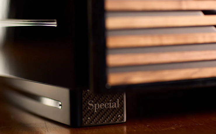 The bottom foot of the REL Carbon Special Black Label Subwoofer which has the word "Special" on it