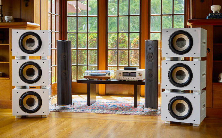 Two stacks of three REL S/850 in a room with other pieces of audio equipment