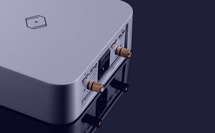 Silent Angel Forester FGC Linear Power Supply in silver - rear and side view with blue lighting reflecting off the surface of the unit