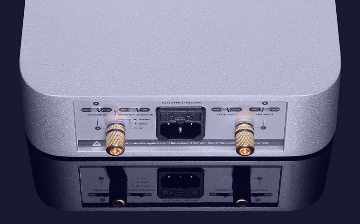 Silent Angel Forester FGC Linear Power Supply in silver viewed from behind with blue lighting reflecting off the unit