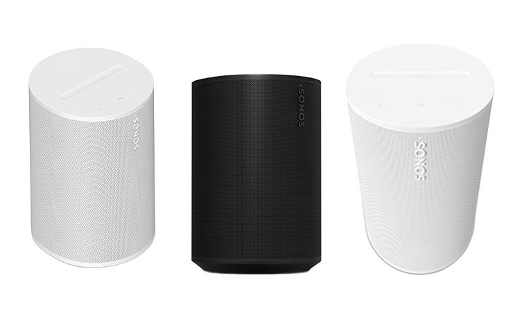 Three Sonos Era 100 SL speakers facing different ways.  Two white and one black.