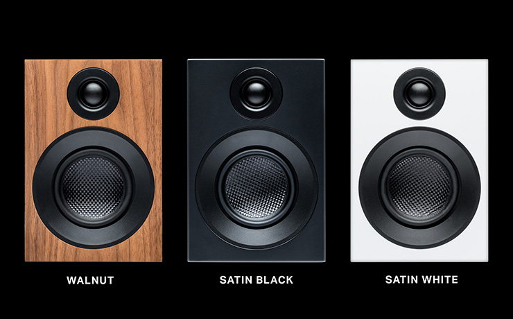 A trio of Speaker Box 3 E Carbon speakers in walnut, black and white