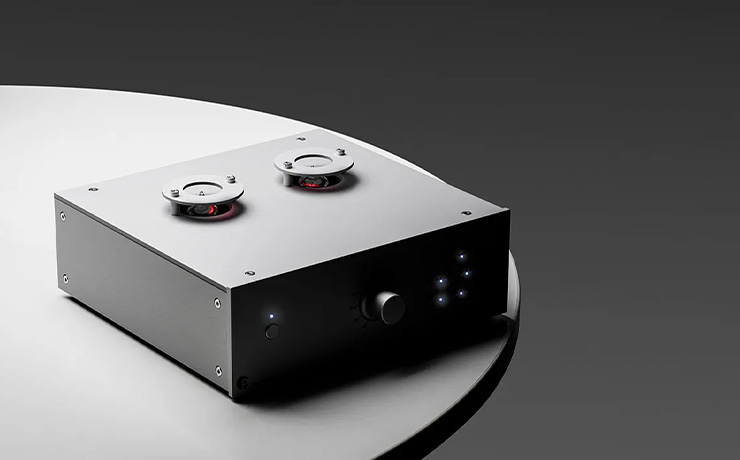 Project Tube Box DS3 B Phono Preamplifier in silver on top of a circular table