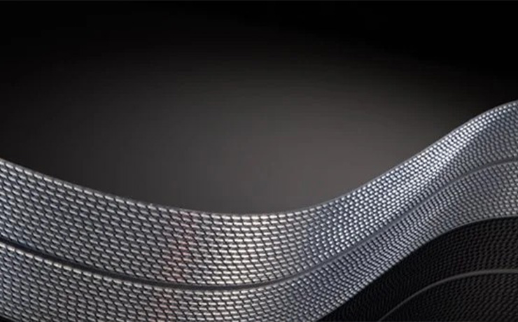A close-up view of the flat Nordost Tyr 2 speaker cable on a dark background
