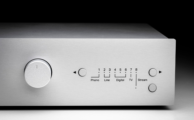 The Project Uni Box S3 amplifier in silver on a dark background