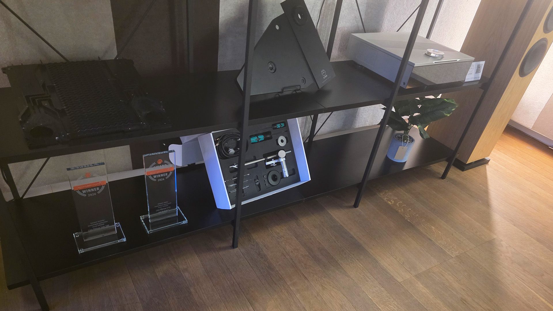 The Linn HiFi rack with a 150 speaker visible and a DSM along with LP12 upgrade options