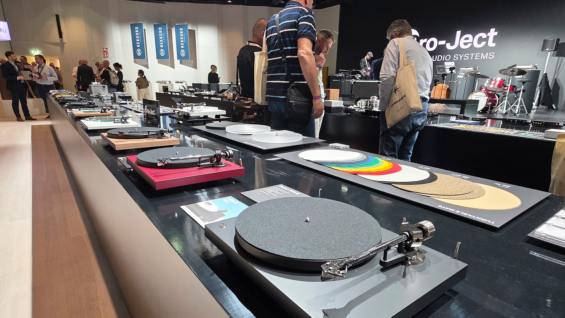 The Project stand at the Vienna HiFi show with man turntables in view along with people having a look