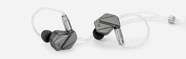 The Astell & Kern Zero 2 earphones laying on a surface.