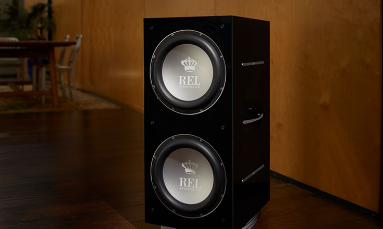 REL 212/SX on a wooden floor in a dining room