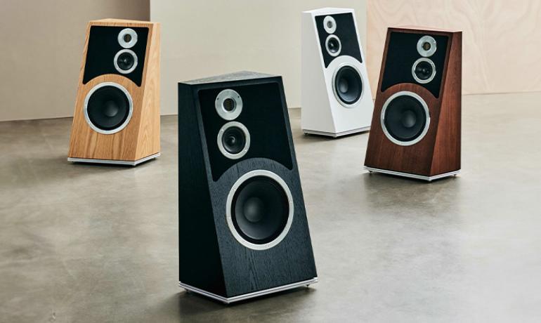 Four Audiovector Trapeze Ri speakers, one in each of the finishes